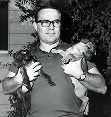 Steve holding puppies