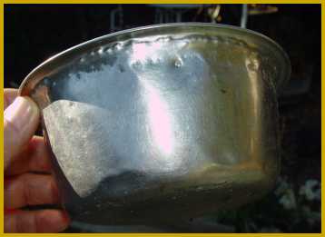 Teeth marks in the metal food/water bowl.